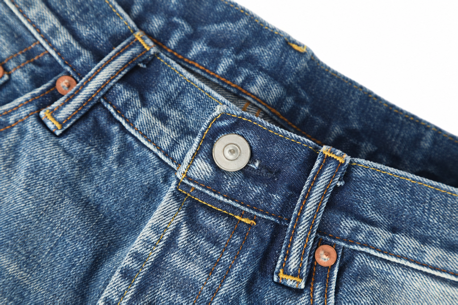 Denim trouser waistband button and seam details
